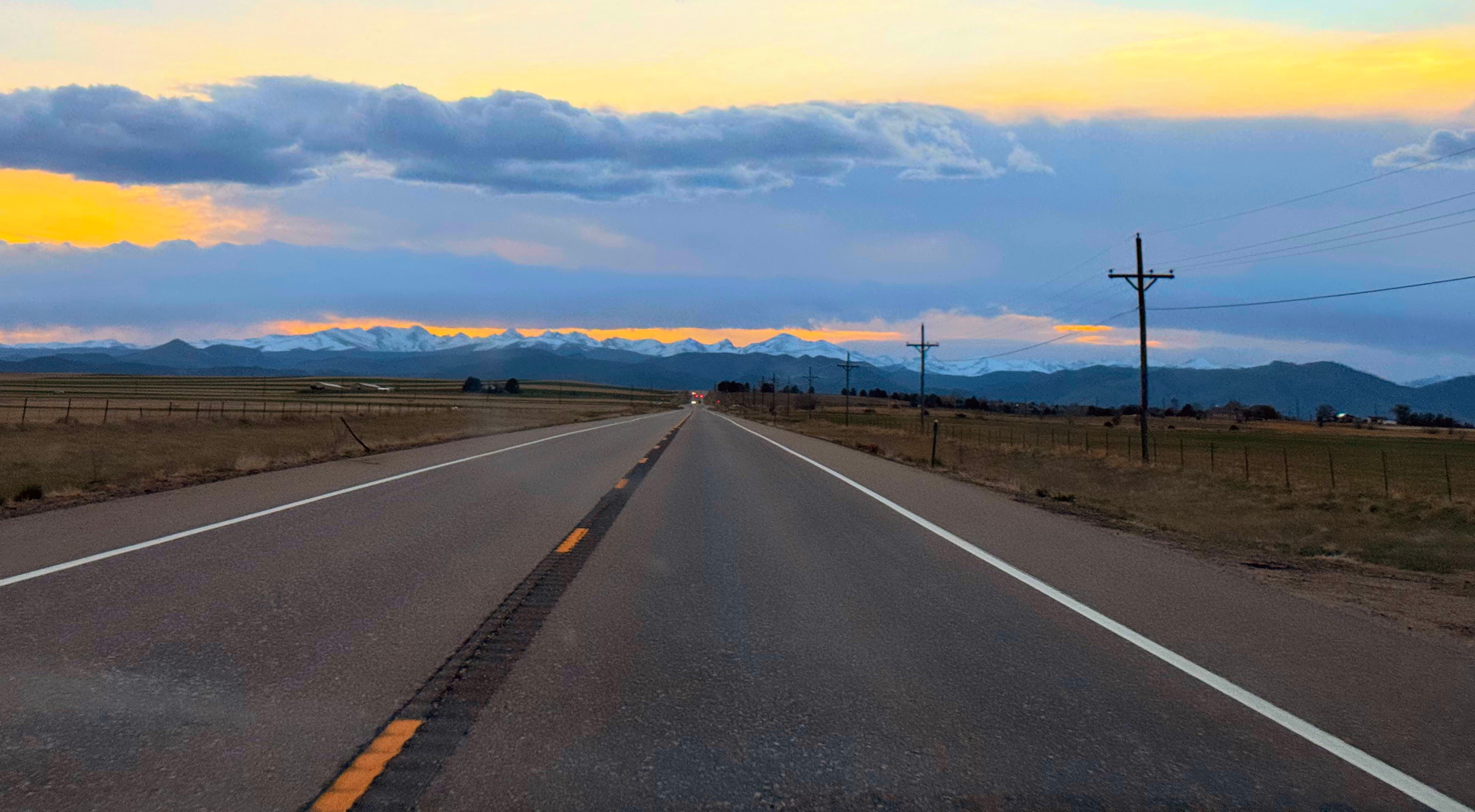 A road unfolding into the mountains.